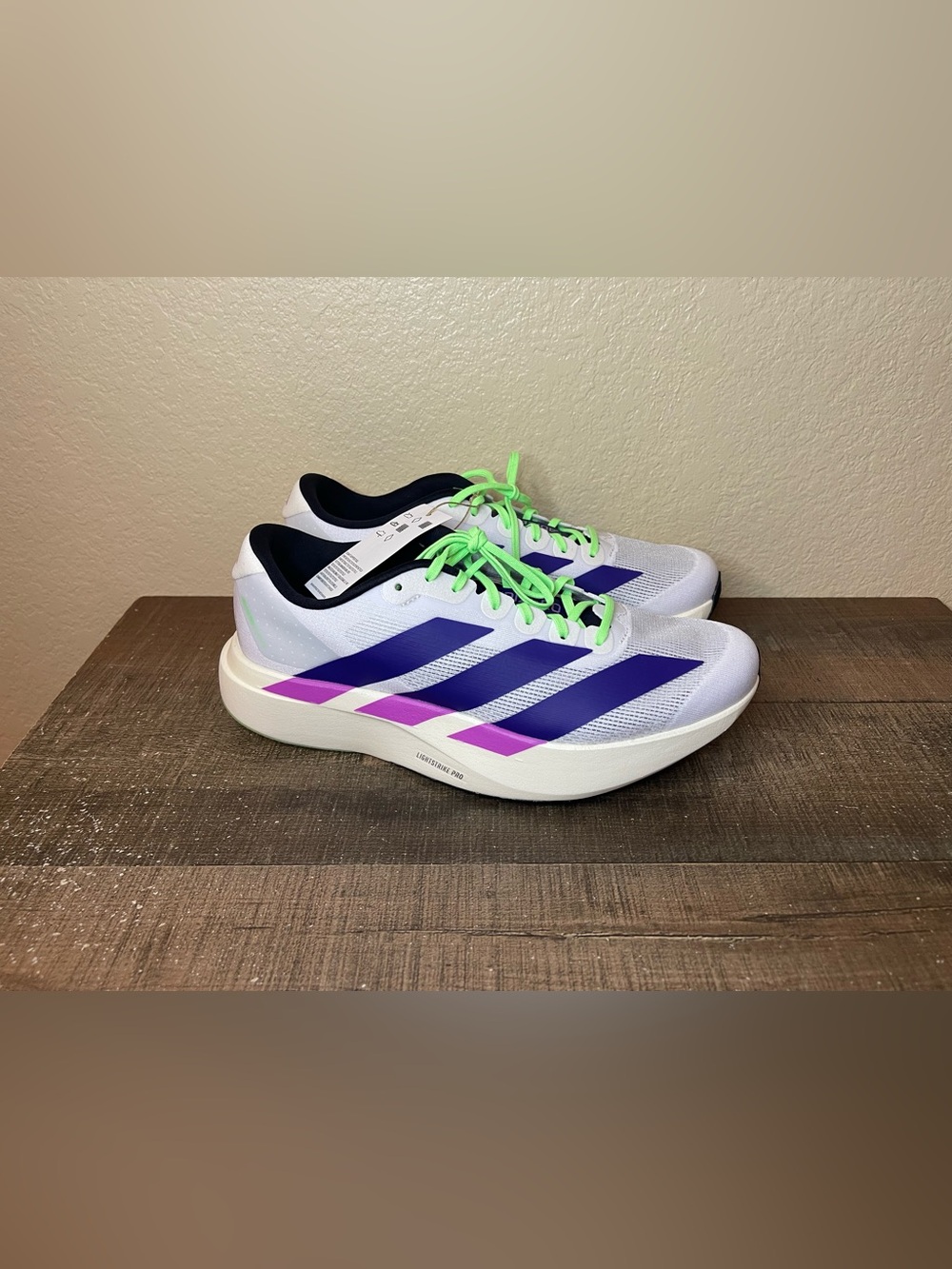 Adidas Adizero Evo SL “White Purple Lime”
- Size 9 Men.